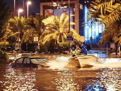 A boat on the flooded main road of the Daeya area of Kuwait City late on Wednesday. 