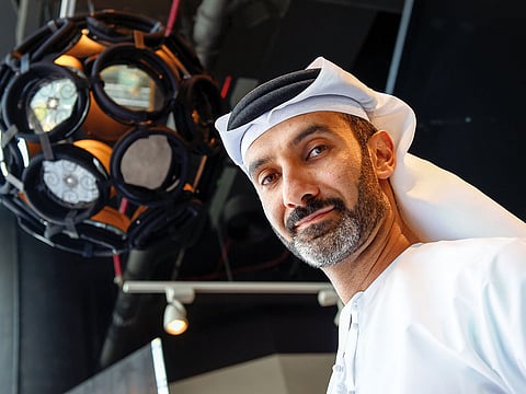 Emirati artist Khalid Shafar along with his latest collection of artwork titled Forma at Dubai Design District, Dubai.