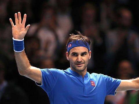 Switzerland's Roger Federer celebrates winning his ATP World Tour Finals men's singles tennis match against South Africa's Kevin Anderson at the O2 arena in London, Thursday, Nov. 15, 2018.