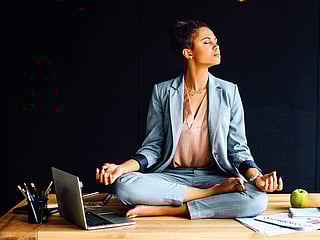 Roll your shoulders, touch your toes, or twist like you’re wringing out the stress.