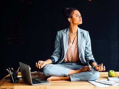 Roll your shoulders, touch your toes, or twist like you’re wringing out the stress.