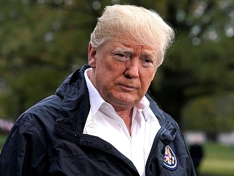 U.S. President Donald Trump talks to the media on the South Lawn of the White House in Washington, U.S., before his departure to California.