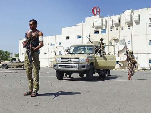 Members of the Yemeni pro-government forces gather in front of the May 22 Hospital on the eastern outskirts of port city of Hodeida on November 15, 2018.