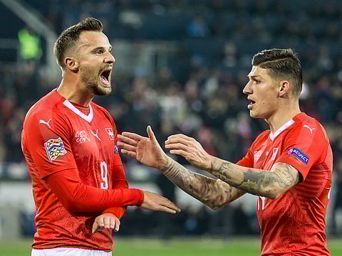 From left, Switzerland's Remo Freuler, Haris Seferovic and Steven Zuber, celebrate.