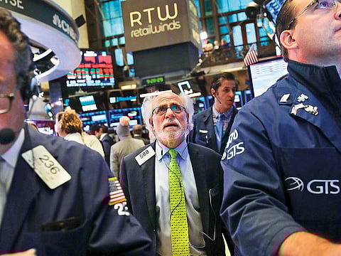 Traders at the New York Stock Exchange. Stocks fell again yesterday morning with the Dow Jones Industrial average plunging over 400 points after the opening bell.