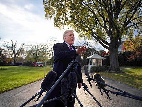 US President Donald Trump speaks as he departs the White House in Washington, DC, on November 20, 2018.