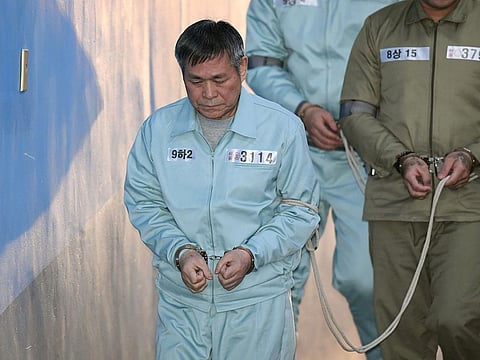 South Korean pastor Lee Jaerock arrives at the Seoul Central District Court to attend his trial in Seoul on November 22, 2018. 