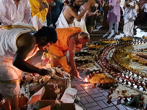 Sri Sri Sugunendra Theertha Swamiji of Udipi lighting a Karthika Deepam at Habitat School in Ajman