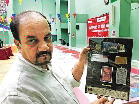 Sanjay N Joshi with his currency collection exhibited at the UAE- India Fest organised by the Indian Social and Cultural Centre (ISC) in Abu Dhabi.