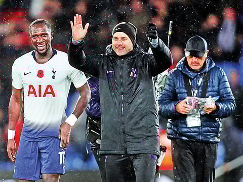 Tottenham manager Mauricio Pochettino and Moussa Sissoko celebrate after the match.