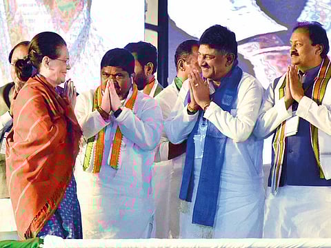 Congress party leader Sonia Gandhi greets members at an election rally in Medchal, Telangana.