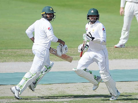 Pakistan’s Azhar Ali (right) and Haris Sohail run between the wickets during the first day of the second Test in Dubai.