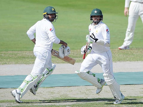 Pakistan’s Azhar Ali (right) and Haris Sohail run between the wickets during the first day of the second Test in Dubai.