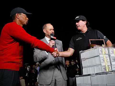 Tiger Woods (left) and Phil Mickelson have been great competitiors on the course and close friends off it.