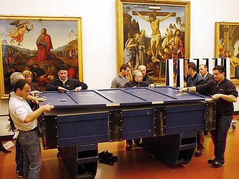Workers at the Uffizi Museum in Florence put the 6.5ft-long, 3ft-tall Leonardo da Vinci’s Annunciation painting in protective crates, when it was loaned out in 2007.