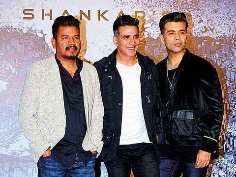 Director S Shankar, Akshay Kumar and producer and director Karan Johar during an event for ‘2.0’ in Mumbai.