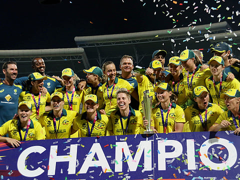 The Australian women's cricket team poses for a photo after winning the final of the Women's World Twenty20 against England in North Sound, Antigua, on Saturday, November 24, 2018. 