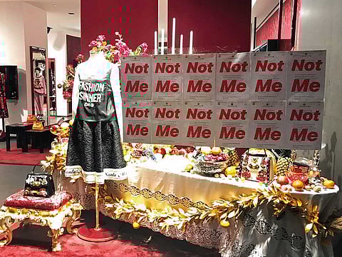 A protest banner on the window of a Dolce & Gabbana store in Shanghai.