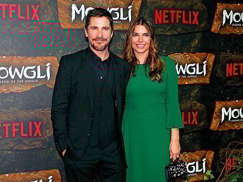 Christian Bale (L) and his wife Sibi Blazic