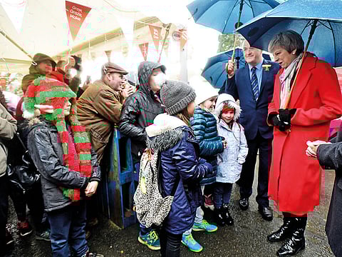 Britain’s Prime Minister May tours the Winter Fair at the Royal Welsh Showground in Builth Wells, Wales,