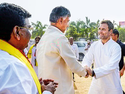 Congress leader Rahul Gandhi greets Andhra Pradesh Chief Minister Chandrababu Naidu during their election campaign rally, in Khammam, Telangana, yesterday.