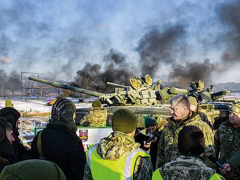 President Petro Poroshenko talking with tankmen during drills near the city of Chernihiv, northern Ukraine. Ukraine’s president imposed martial law in border regions on Wednesday for 30 days in 10 regions bordering Russia, the Black Sea and the Azov Sea.