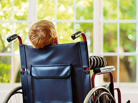 A boy on a wheelchair. For illustrative purposes only.