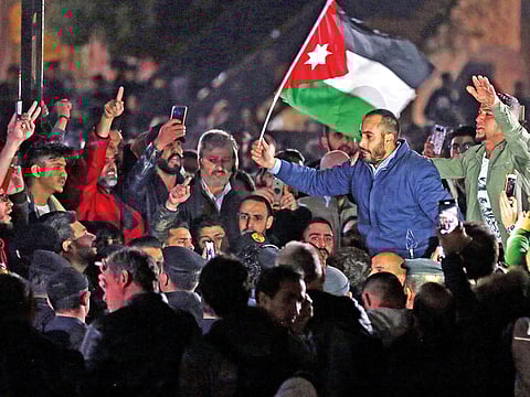 Hundreds of Jordanians protested on Friday in central Amman in the first demonstration against a new tax bill, backed by the International Monetary Fund (IMF), that was passed last month.