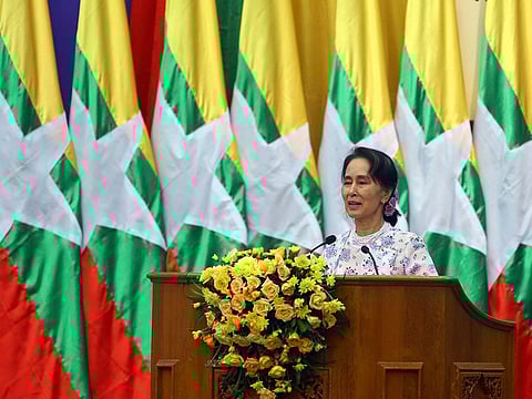 Myanmar's leader Aung San Suu Kyi smiles as she delivers a speech during the Advisory Forum On National Reconciliation and Peace in Myanmar at the Myanmar International Convention Center in Naypyidaw, Myanmar, Wednesday, Nov. 21, 2018.