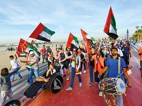 A section of the crowd make merry during the UAE Solidarity Walk  held on the occasion of National Day at Mamzar beach tracks in Dubai.