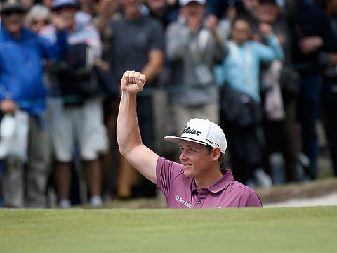 Australia's Cameron Smith reacts after hitting out of a bunker during the World Cup of Golf in Melbourne, Australia, Sunday, Nov. 25, 2018