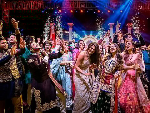 Bollywood actress Priyanka Chopra, center right dances  with guests during a ceremony before her wedding with Nick Jonas , at Umaid Bhawan in Jodhpur, India. 