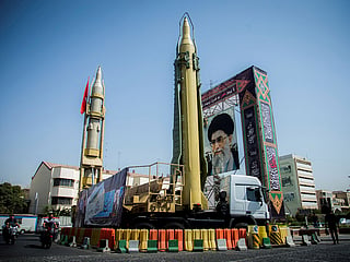 A display featuring missiles and a portrait of Iran's Supreme Leader Ayatollah Ali Khamenei is seen at Baharestan Square in Tehran, Iran. 