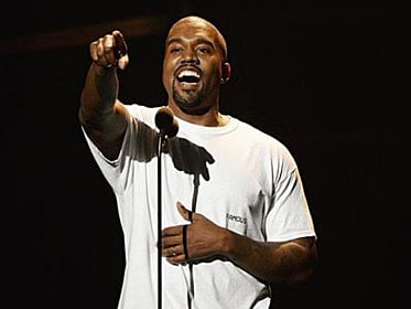 Kanye West apologises for using phone at Cher show