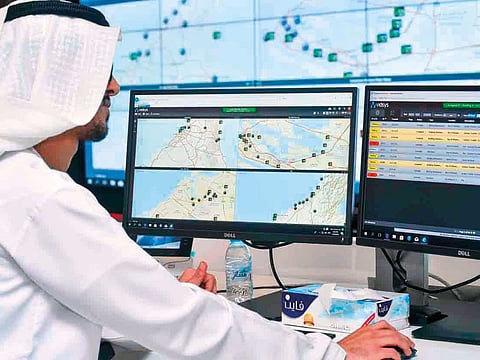 An officer monitors for fire alerts on his screen at the operation centre of Hassantuk. 