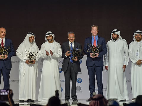 Shaikh Hamdan Bin Mohammad, Shaikh Ahmad Bin Mohammad and Jamal Bin Huwaireb with the winners of Mohammed Bin Rashid Al Maktoum Knowledge Awards in Dubai.