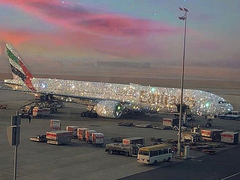 An Emirates plane is covered in diamonds.