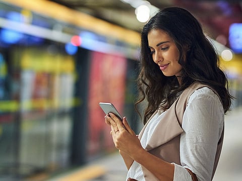 A young woman using a smartphone.