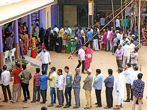Indians stand in a queue to cast their votes in Hyderabad, India, Friday, December 7, 2018.