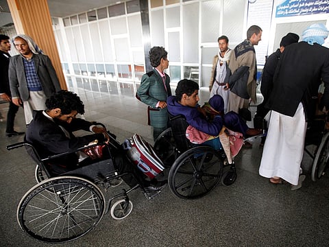 Wounded Houthi fighters wait at Sanaa airport during evacuation from Yemen December 3, 2018. 