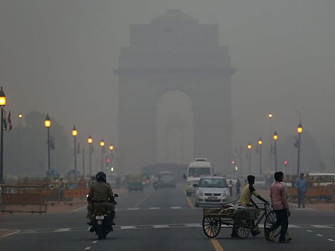 Traffic make way in haze mainly caused by air pollution in Delhi 
PTI