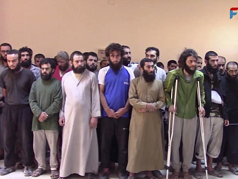 This frame grab from video released on October 15, 2017, shows Syrian Daesh militants who have surrendered, at a base of the US-backed Syrian Democratic Forces, in Raqqa, Syria.