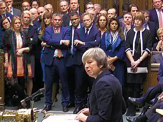 Pound slips to 18-month low as May pulls Brexit vote