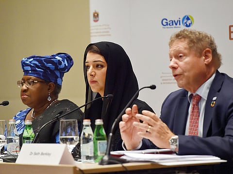 Reem bint Ebrahim Al Hashimy Cabinet Member and Minister of State for International Cooperation (centre) with Dr. Ngozi Okonjo Iweala (1st right) and Dr Seth Berkly are seen at the press brief on the  GAVI Alliance Mid-term Review to discuss details about MBZ’s donation towards vaccines in Abu Dhabi.
