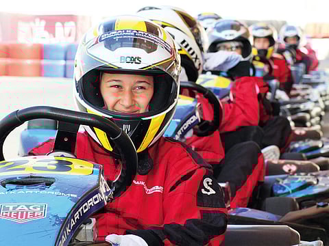 Young drivers at the Dwight School Festival of Speed held at Dubai Autodrome. 