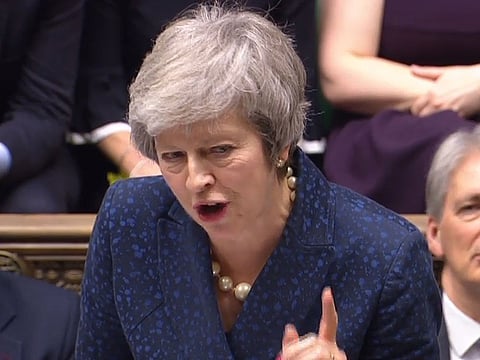 A video grab from footage broadcast by the UK Parliament's Parliamentary Recording Unit (PRU) shows Britain's Prime Minister Theresa May attending the weekly Prime Minister's Questions (PMQs) in the House of Commons in London on December 12, 2017.