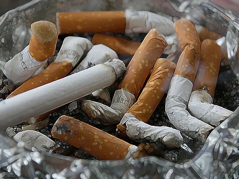 Ashtray full of cigarette butts. For illustrative purposes only.