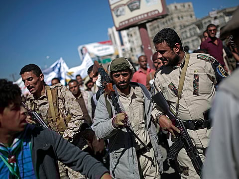 Houthi fighters take part in a protest calling for the reopening of Sanaa airport to receive medical aid, in front of the U.N. offices in Sanaa