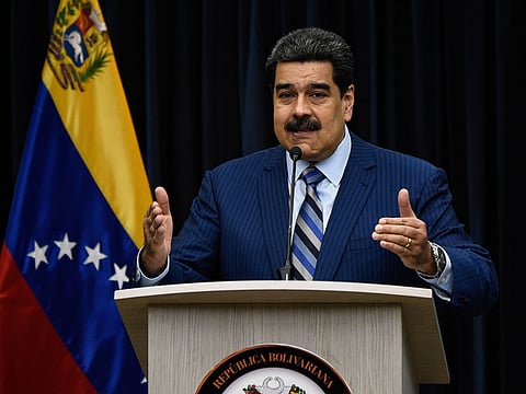 Venezuela's President Nicolas Maduro speaks during a press conference with international media correspondents, at the Miraflores presidential palace in Caracas, on December 12, 2018.