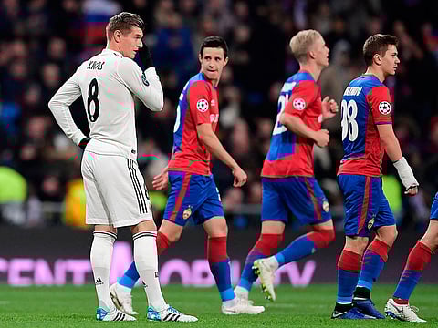 Real Madrid's German midfielder Toni Kroos reacts to CSKA players celebrating their third goal during the UEFA Champions League group G football match between Real Madrid CF and CSKA Moscow at the Santiago Bernabeu stadium in Madrid on December 12, 2018. 